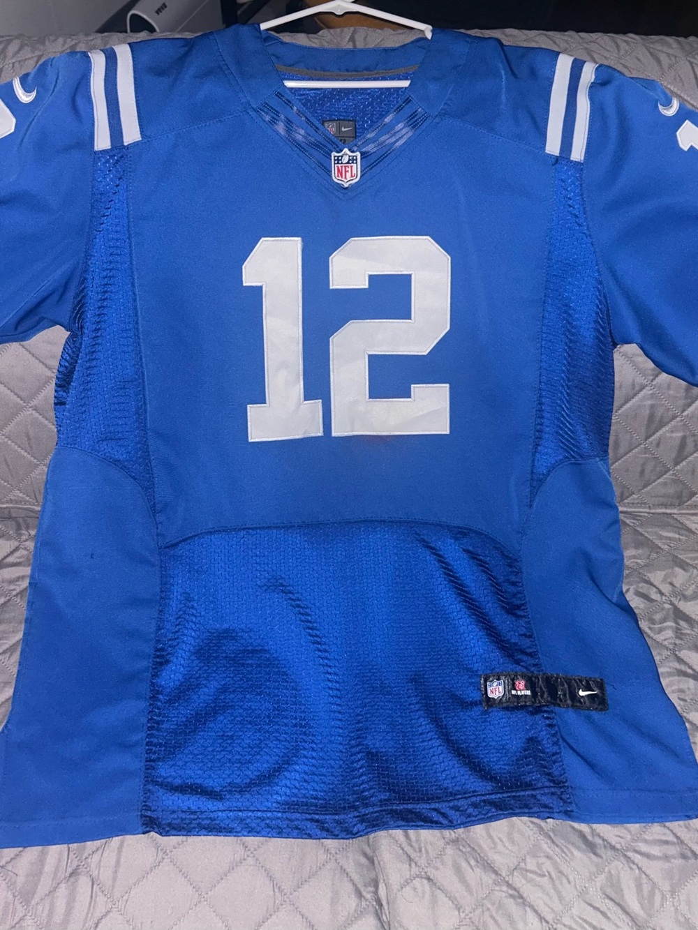 Nike Men’s Royal Blue #12 LUCK Football Jersey with White Accents.